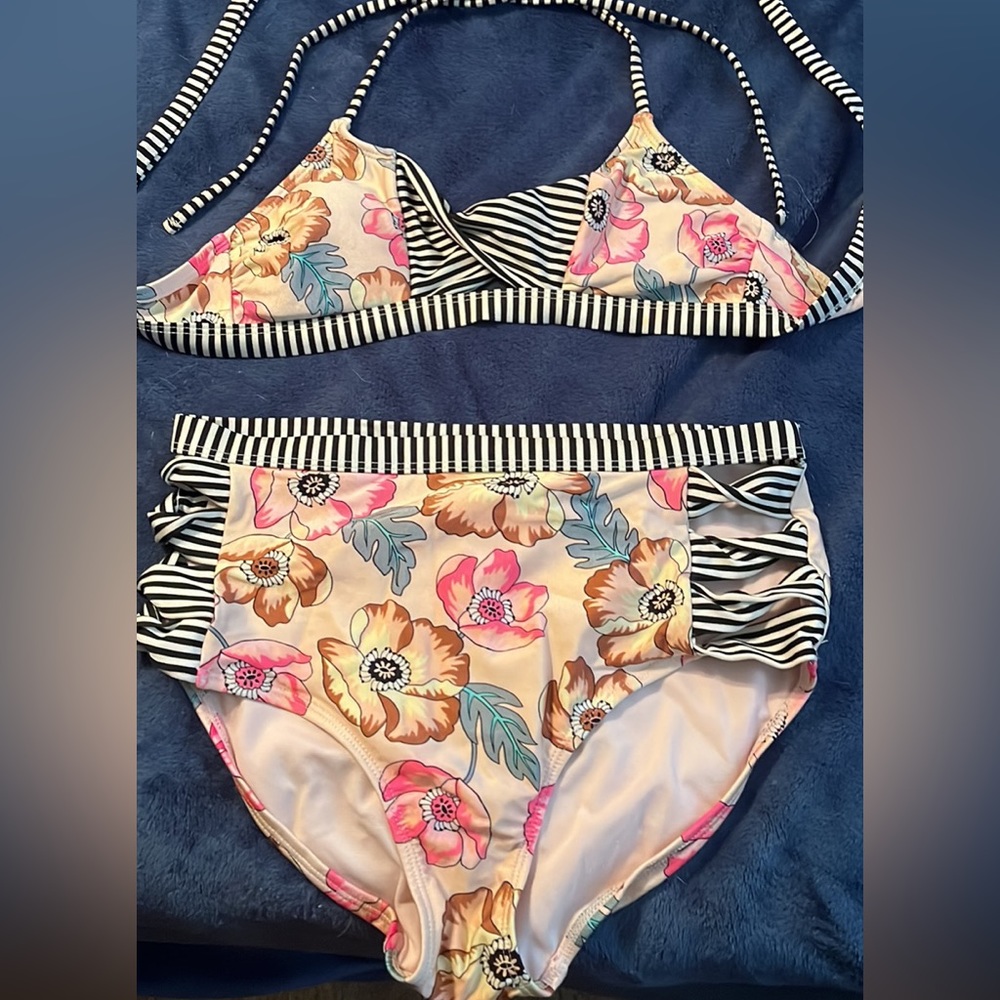 Black, white, and pink women’s bathing suit